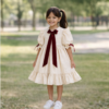 Robe élégante fille avec nœud rouge fantaisie
